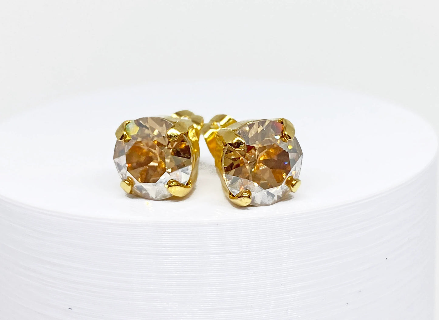 Swarovski Crystal Stud Earrings in Crystal Golden Shadow, set in a gold pronged setting