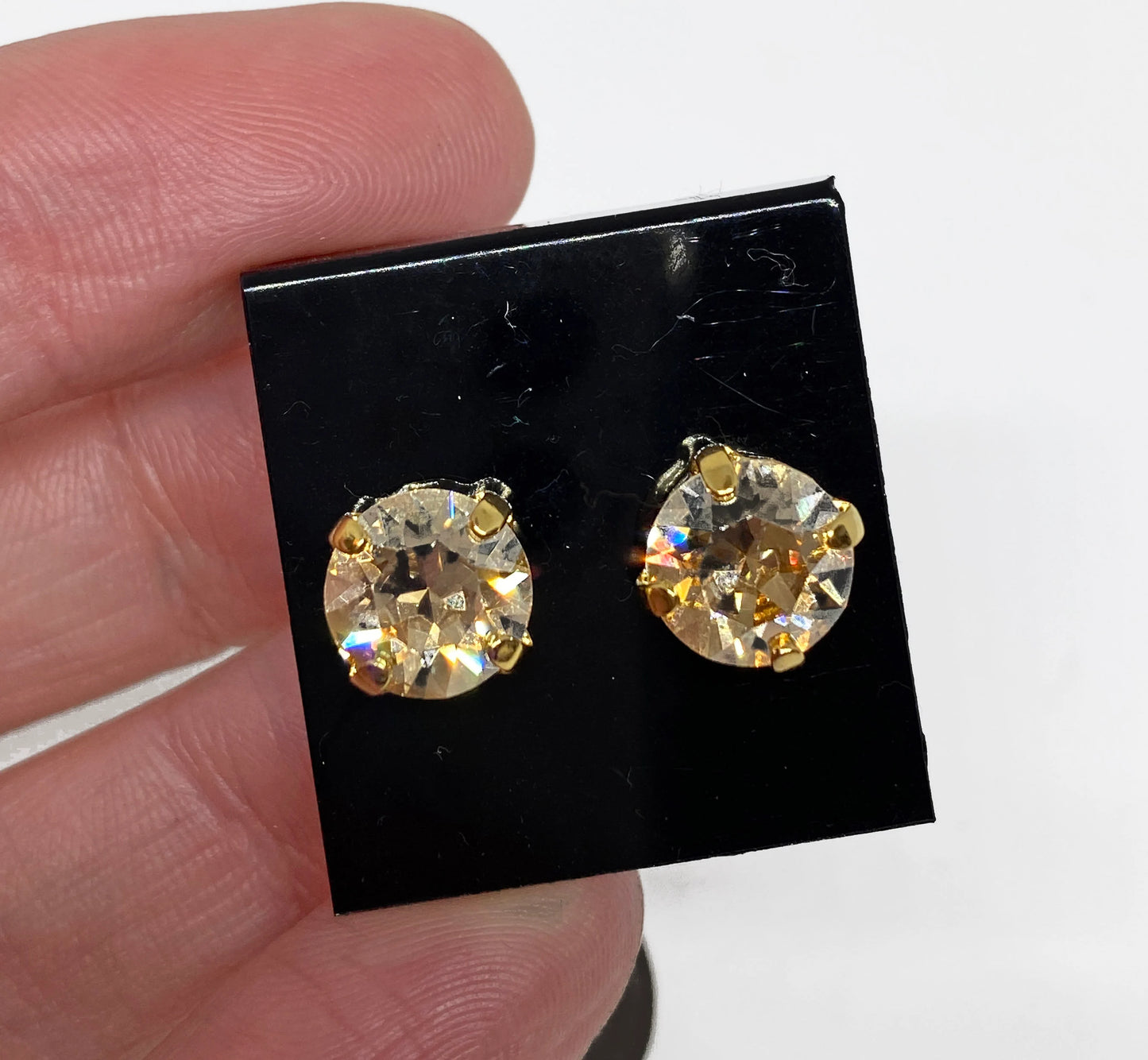 Swarovski Crystal Stud Earrings in Crystal Golden Shadow, set in a gold pronged setting