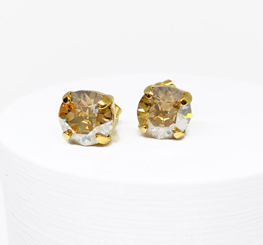 Swarovski Crystal Stud Earrings in Crystal Golden Shadow, set in a gold pronged setting